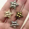 Suministro directo botón metálico de estrella de cinco puntas retro botón pequeño fragancia estilo europeo y americano suéter abrigo abrigo de cuero accesorios de joyería
