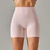 Pantalones de yoga de estilo nuevo sin línea de vergüenza color piel para mujer, cintura alta, realce de glúteos, compresión abdominal, shorts deportivos de tres puntos