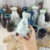 Comercio exterior fábrica personalizada mayoreo cerámica estilo japonés jarra para calentar vino cálida jarra para vino transparente medio jin dos liang licor sake separador de vino