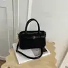 Bolso de mano con acabado mate retro, nueva colección otoño/invierno 2026, bolso cruzado versátil para mujer, bolso tote moderno y popular, bolso de mano pequeño
