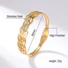 Pulsera de acero de titanio con hoja de oro chapada en oro galvanizado al por mayor para mujer sencilla transfronteriza, joyería de alta gama que no se desvanece