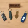 Chaveiro de Couro PU Transfronteiriço com Costura Dupla Face e Logotipo Imprimível, Pingente Simples de Couro, Chaveiro de Carro para Homens e Mulheres