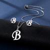 Suministro transfronterizo 26 letras inglesas collar aretes traje moda europeo y americano retención de color brillante acero inoxidable cadena clavicular