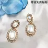 Moda Cruzada Europeia e Americana Personalizada para o Dia a Dia Brincos Decorativos Ovais de Renda com Pérolas Artificiais Exquisitos e Compactos Atacado
