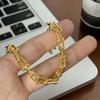 Pulsera de herradura en forma de U con explosiones transfronterizas de alto nivel, tendencia de personalidad para mujer, accesorios de cadena geométrica simple dorada, venta al por mayor