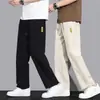 Calça Longa Masculina de Seda Gelada para Verão 2026 Novo Estilo Solta Esportiva Tendência Casual Roupa de Trabalho Secagem Rápida Fina Calça de Agasalho