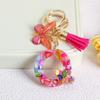 Llavero con borla de mariposa de 26 letras con pegamento de piedra de cristal y 26 letras de Creative Europe y Estados Unidos, joyería colgante.