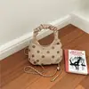 Bolso pequeño súper popular para mujer, nuevo de verano 2026, vintage, exquisito, para el trabajo, de hombro, cruzado, con cadena