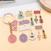 Accesorio de aleación con goteo de aceite, nota musical de guitarra, violín, piano, colgante para collares, llaveros y joyería DIY