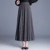 Saia plissada elegante e estilosa para mulheres, novidade outono e inverno 2026, cintura alta, cobre o quadril, comprimento médio com caimento moderno e barra larga