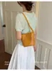 Bolso tejido de nicho súper popular transfronterizo para mujer, nuevo bolso cruzado versátil de moda 2026, bolso de mano pequeño, bolso tipo cubo para teléfono