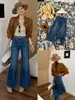 Popular top otoñal mejorado estilo europeo Guangzhou Trece Líneas Jeans acampanados elásticos 360 grados French con cinturón 13335