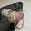 Bolsa de Textura Niche Feminina Bolsa de Mão Verão 2025 Nova Bolsa Simples de Bolinho Bolsa de Ombro Fashion Bolsa Transversal