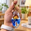 Llavero Creativo Portátil con Colgante Líquido del Mundo Marino, Juguete Delfín de Arena Movediza para Alivio del Estrés, Regalo de Cumpleaños