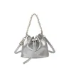 Bolso tipo cubo de moda coreana transfronterizo para mujer, nuevo de verano 2026, color liso, elegante, de un solo hombro, para ir al trabajo, bandolera