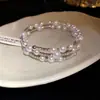 Pulsera de perlas en forma de gota de agua con diamantes de estilo vintage francés, de lujo ligero con un toque de alta gama, pulsera elegante, joyería exquisita estilo princesa