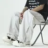 Pantalones casuales nuevos de primavera y verano para hombres y mujeres, pantalones de pierna ancha holgados de color liso con cremallera, diseño de malla a rayas, pantalones largos de estilo callejero