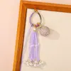 Nuevo Bolso Colgante de Bola de la Suerte Tejido a Mano Bolso Colgante Encanto Tendencia Nacional Nicho Borla Llavero de Pareja Colgante Venta al por Mayor