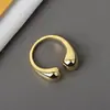 Anillo de diseño de nicho geométrico irregular con apertura de gota de aleación retro minimalista anillo liso para pareja