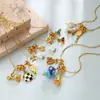 Collar de cadena fina de hueso de serpiente dorada con colgante de lazo desmontable de perlas estilo retro de chica dulce transfronterizo europeo y americano