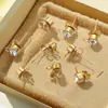 Moda coreana aretes de acero inoxidable chapados en oro accesorios al por mayor diseño creativo de personalidad con anillo de acero aretes de circonita diy