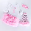 Ropa infantil al por mayor: Traje de cuatro piezas de algodón de alta calidad, moda festiva, manga larga, falda de seis capas, para bebés de 0 a 2 años.