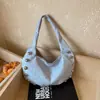 Bolso de axila estilo coreano con estrellas para mujer, nuevo modelo 2026, bolso de hombro de alta apariencia, versátil para el trabajo, con un diseño único