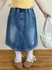 Colección Primavera 2026 Ropa Infantil Estilo Coreano Moda para Niñas Camiseta de Manga Larga Linda y Divertida de Dibujos Animados con Parche Falda de Mezclilla