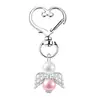 Chaveiro de asa de anjo criativo transfronteiriço, acessório de pingente de liga para bolsas, festas, feriados, presentes feitos à mão, atacado