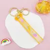 Llavero Colgante de Cordón de Cuero con Letra Transparente Brillante con Accesorios Estilo Muñeca Rellena de Aceite Encanto de Llavero Pulsera Venta al por Mayor