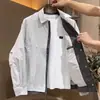 Chaqueta de solapa nuevo estilo Primavera y Otoño, cuadros de retazos casuales para hombre, look de dos piezas moderno y versátil, estilo coreano, marca de moda