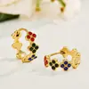 Pendientes de moda de nicho de alta gama estilo ins, pendientes de flor de cuatro hojas con circonita de acero inoxidable chapado en oro que conserva el color para mujer