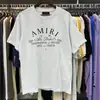 AM1R1 ICON Marca Tendência de Nicho Pombinha da Paz Estampada com Letras Gola Redonda Solta Manga Curta Camiseta para Homens e Mulheres Casal Meia-manga