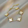 Comercio Electrónico Transfronterizo Europeo y Americano Popular Pulsera de Acero de Titanio Doble Cara Oro de 18 Quilates Trébol de Cuatro Hojas de la Suerte Joyería de Acero Inoxidable para la Mano Venta al por Mayor