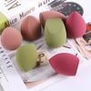 Los fabricantes venden al por mayor nuevos huevos de belleza, gotas de calabaza, borlas oblicuas para polvos, no comen huevos de maquillaje en polvo, secos y húmedos, de doble uso.