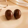 Pendientes de Botón Ovalados de Resina Transfronterizos Europeos y Americanos Pendientes Maillard de Otoño e Invierno Pendientes Simples de Moda Versátiles para Mujer Sensación de Alta Gama