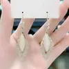Pendientes 2022 Nueva Moda Piedra Ojo de Gato Pendientes adelgazantes que reducen la edad con pendientes de temperamento de moda súper brillantes