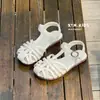 Sandalias de Verano 2026 Estilo Nuevo Estilo Coreano Niños Corte Calado Tejidas Forma de T Suela Suave Puntera Protectora Sandalias para Niñas