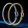 Pulsera trenzada con hebilla de herradura estilo europeo y americano Pulsera de acero de titanio simple y de moda Pulsera ajustable de acero de titanio estilo europeo y americano Pulsera de alambre de acero