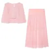 Venta al por mayor de ropa de mujer transfronteriza otoño 2026 nuevo diseño europeo y americano conjunto de top sin mangas y falda de alta gama elegante