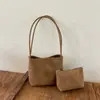 Bolso de axila de nicho de alta gama para mujer, nuevo modelo de verano 2026, bolso de cubo de axila de un solo hombro súper popular y exquisito