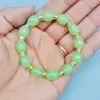 Barraca de ponto cênico vendendo joias feitas à mão com miçangas imitação de jade contas de barril pulseira de vidro atacado masculino e feminino este ano pulseira