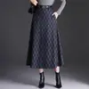 Falda de lana a cuadros para mujer, nuevo estilo otoño e invierno 2026, de cintura alta, estilo universitario, de longitud media, falda elegante y moderna de línea A para mujer