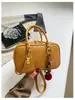 Bolsa de Ombro Boston de Mão Niche Feminina 2026 Novo Estilo Moda Casual Textura Trançada Bolsa Transversal Versátil Bolsa Almofada