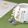 Pendientes cloisonné estilo palaciego clásico de ratán de árbol antiguo de mil años, flor de concha tejida a mano, pendientes sencillos de longitud media, joyería
