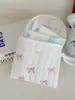 Bolsa de Toalla Nueva Fresca Ins con Lazo Transfronteriza Tía Dulce Portátil para Mujer Bolsa para Monedas Menstruales Cosméticos