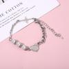 Pulsera de diseño网红 estilo japonés y coreano reflectante con costuras de perlas para hombres y mujeres estilo hip hop frío INS suministro directo de fábrica