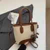 Bolso de mano tipo cubo nuevo de primavera 2026, transfronterizo, estilo vintage simple, de alta gama, moderno, para ir al trabajo, bolso de hombro cruzado de moda