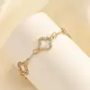 Suministro Transfronterizo Nuevo Modelo Flor de Cuatro Hojas Hueca Microincrustada de Zirconia Conjunto de Tres Piezas Estilo Europeo y Americano Hiyin Comercio Exterior Conjunto de Joyería de Venta Caliente