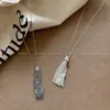Collar de Borlas Plateadas Estilo Mismo de Bloguera Coreana para Mujer 2025 Nueva Cadena Larga para Clavícula Diseño de Nicho Accesorios para Sudaderas